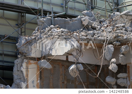 Reinforced concrete building under demolition Reinforced concrete building under demolition 142248586