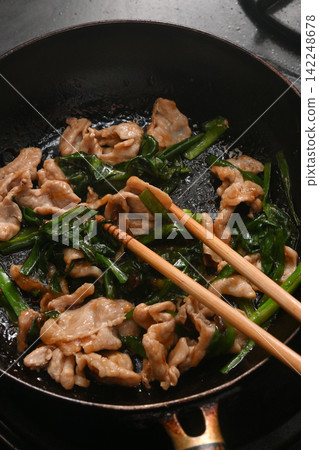 Pork chives being cooked Pork chives being cooked 142248678