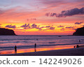 Stunning tropical beach sunset with glowing orange 142249026