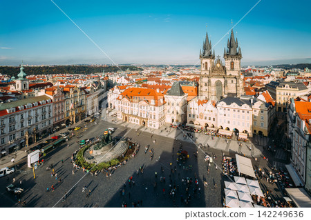 Wide aerial view of the bustling Old Town Square in Prague. Wide aerial view of the bustling Old Town Square in Prague. 142249636