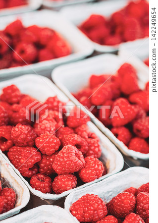 Fresh Raspberries in Baskets at farmers local Market Fresh Raspberries in Baskets at farmers local Market 142249654