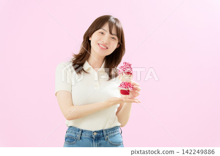 A smiling woman posing with her favorite plushie. A smiling woman posing with her favorite plushie. 142249886