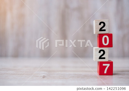 2027 wooden Blocks arrange on table background. Business, Risk Management, Resolution, strategy, goal, New Year New You and happy holiday concepts 142251096