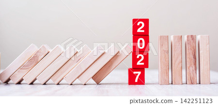 Red 2027 cube blocks stop falling blocks on table. Business, Risk Management, Insurance, Resolution, strategy, solution, goal, New Year planning and investment concepts Red 2027 cube blocks stop falling blocks on table. Business, Risk Management, Insurance, Resolution, strategy, solution, goal, New Year planning and investment concepts 142251123