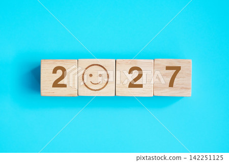 Smile face block with 2027 text on blue background. Satisfaction, feedback, Review and New Year concepts Smile face block with 2027 text on blue background. Satisfaction, feedback, Review and New Year concepts 142251125