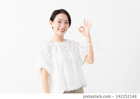 A woman wearing a white blouse - Lifestyle image A woman wearing a white blouse - Lifestyle image 142252148