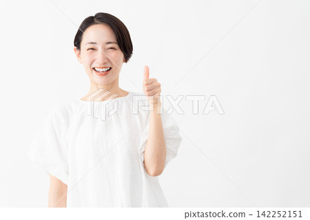 A woman wearing a white blouse - Lifestyle image A woman wearing a white blouse - Lifestyle image 142252151