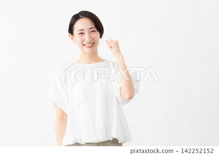 A woman wearing a white blouse - Lifestyle image A woman wearing a white blouse - Lifestyle image 142252152