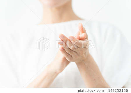 A woman wearing a white blouse - Lifestyle image A woman wearing a white blouse - Lifestyle image 142252166