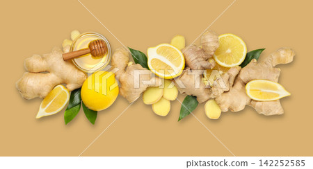 Ginger root, lemon slices, and honey jar arranged stylishly Ginger root, lemon slices, and honey jar arranged stylishly 142252585