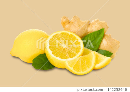 Ginger root and lemon slices arranged beautifully on plain backdrop Ginger root and lemon slices arranged beautifully on plain backdrop 142252646