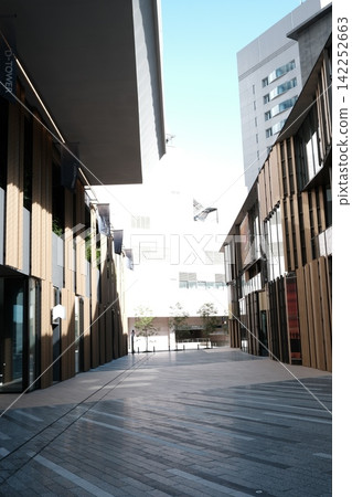 Modern street architecture design: Geometric patterns created by the sky and shadows Modern street architecture design: Geometric patterns created by the sky and shadows 142252663