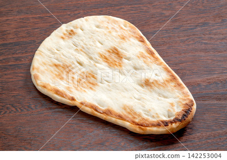 Naan, a flatbread from South Asia and India. Naan, a flatbread from South Asia and India. 142253004