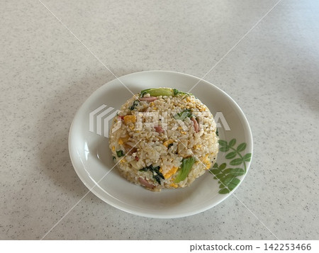 Lettuce fried rice served on a white plate Lettuce fried rice served on a white plate 142253466