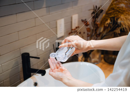 Women hand washing hands with water Women hand washing hands with water 142254419