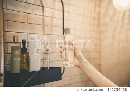 A close-up of a woman's hand, without showing her face. A close-up of a woman's hand, without showing her face. 142254468