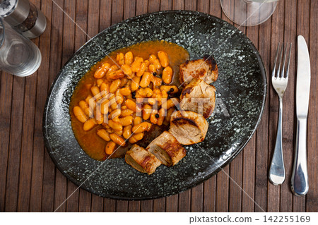 Pieces of delicious pork with beans Pieces of delicious pork with beans 142255169