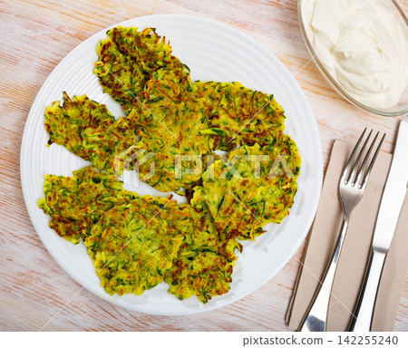 Fried zucchini fritters Fried zucchini fritters 142255240