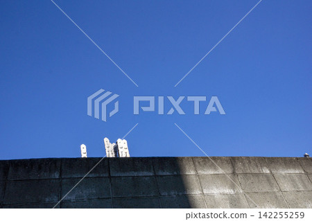 A memorial tablet stands out against the blue sky. A memorial tablet stands out against the blue sky. 142255259