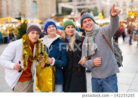 Portrait of a happy European family an Christmas fair Portrait of a happy European family an Christmas fair 142255285