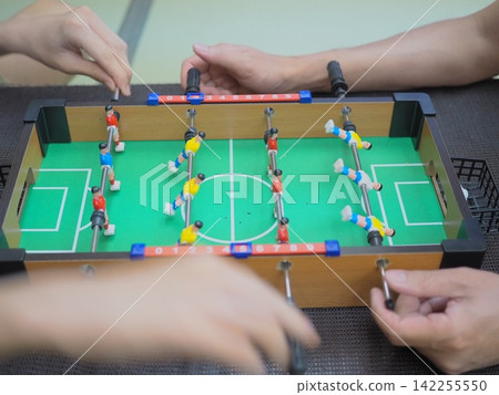 Image of playing table football Image of playing table football 142255550