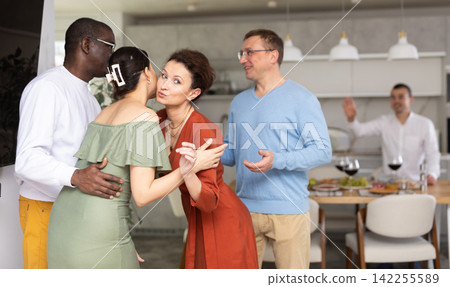 Group of friends greeting each other Group of friends greeting each other 142255589