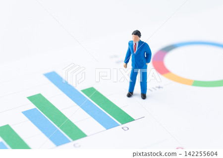 Businessman and graph Businessman and graph 142255604