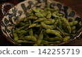 Salt-boiled edamame from Yamagata Prefecture, served in a bowl as a summer snack. 142255719