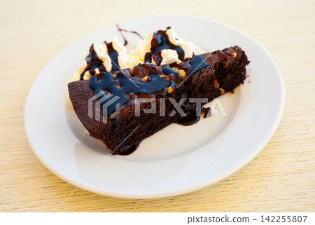 Sweet traditional chocolate brownie cake Sweet traditional chocolate brownie cake 142255807