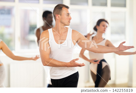 Group of dancers rehearsing ballet dance Group of dancers rehearsing ballet dance 142255819