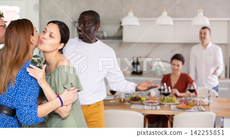 Two women greet each other when meeting Two women greet each other when meeting 142255851