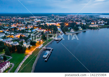 Flight over evening city of Uglich and Epiphany Cathedral on banks of Volga River Flight over evening city of Uglich and Epiphany Cathedral on banks of Volga River 142255904