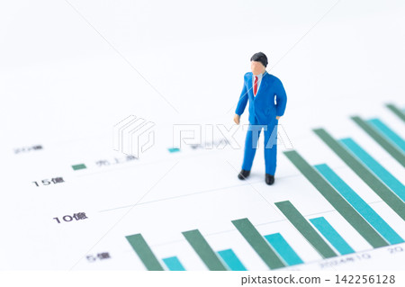 Businessman and graph Businessman and graph 142256128