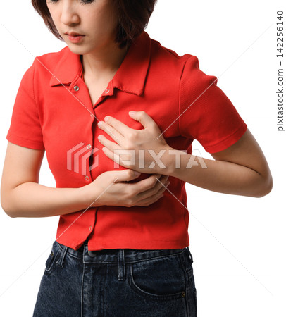 Worried asian woman suffering severe chest pain holding breast with acute ache symptom isolated on plain background feeling sick Worried asian woman suffering severe chest pain holding breast with acute ache symptom isolated on plain background feeling sick 142256140