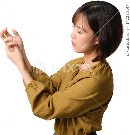 Unhappy asian woman suffering from painful wrist ache and joint stiffness while holding hand isolated on transparent background Unhappy asian woman suffering from painful wrist ache and joint stiffness while holding hand isolated on transparent background 142256147