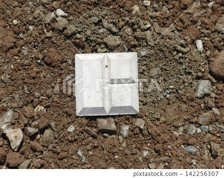 Concrete boundary markers driven into the ground (land surveying/boundary markers) Concrete boundary markers driven into the ground (land surveying/boundary markers) 142256307