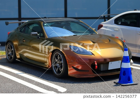 Gold Japanese sports car Gold Japanese sports car 142256377