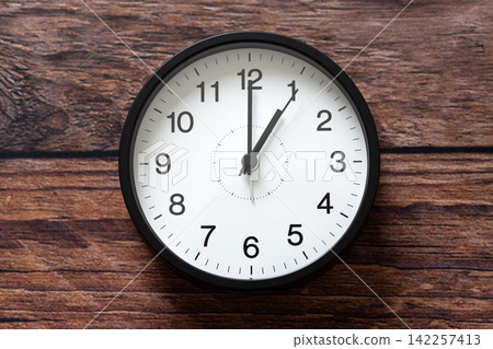 A clock showing 1 o'clock A clock showing 1 o'clock 142257413