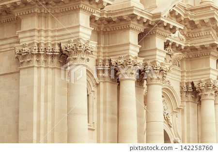 Majestic ancient Greek temple colonnade with intricate Corinthian capitals and ornate frieze Majestic ancient Greek temple colonnade with intricate Corinthian capitals and ornate frieze 142258760