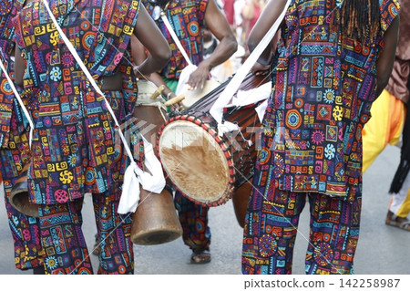 Kenyan folk artists marching in the street Kenyan folk artists marching in the street 142258987
