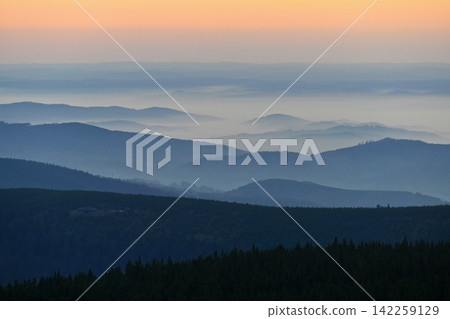 Beautiful landscape and sunset in the mountains. Hills in clouds. Jeseniky - Czech Republic - Europe. Beautiful landscape and sunset in the mountains. Hills in clouds. Jeseniky - Czech Republic - Europe. 142259129