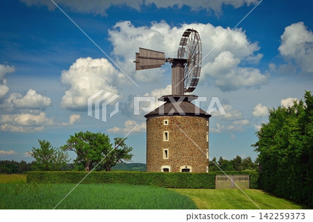 Beautiful old windmill at sunset with sky and clouds. Ruprechtov - Czech Republic - Europe. Beautiful old windmill at sunset with sky and clouds. Ruprechtov - Czech Republic - Europe. 142259373