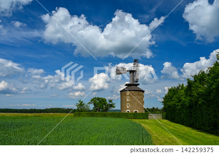 Beautiful old windmill at sunset with sky and clouds. Ruprechtov - Czech Republic - Europe. 142259375