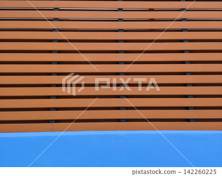 Minimalist Blue Wall and Wooden Slats Background Minimalist Blue Wall and Wooden Slats Background 142260225