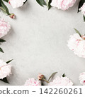 Pink Peonies Frame on Light Stone Background 142260261