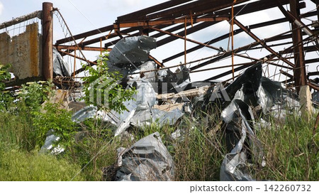 View to destroyed residential buildings at Kharkivska oblast. Ruined houses after bomb attacks on ukrainian territory from russia army. Consequences of russian invasion of Ukraine. Slow motion View to destroyed residential buildings at Kharkivska oblast. Ruined houses after bomb attacks on ukrainian territory from russia army. Consequences of russian invasion of Ukraine. Slow motion 142260732