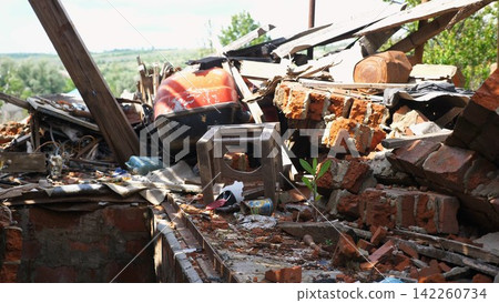 View to destroyed residential buildings at Kharkivska oblast. Ruined houses after bomb attacks on ukrainian territory from russia army. Consequences of russian invasion of Ukraine. Slow motion View to destroyed residential buildings at Kharkivska oblast. Ruined houses after bomb attacks on ukrainian territory from russia army. Consequences of russian invasion of Ukraine. Slow motion 142260734