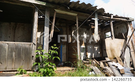 View to destroyed residential buildings at Kharkivska oblast. Ruined houses after bomb attacks on ukrainian territory from russia army. Consequences of russian invasion of Ukraine. Slow motion 142260735