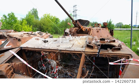 Rusty and burned-out armored vehicles on ukrainian territory. Exhibition of destroyed military equipment of the russian army. War between Ukraine and russia. Close up Slow motion 142260738
