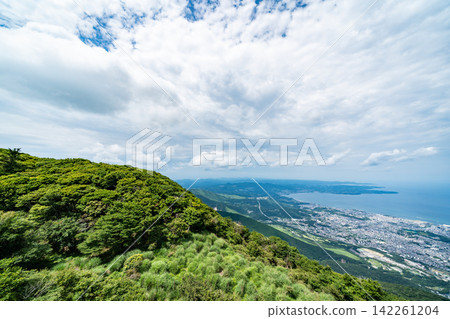 Panoramic aerial view of Beppu city and Beppu bay under blue sky with clouds from mountain viewpoint in Oita Japan Panoramic aerial view of Beppu city and Beppu bay under blue sky with clouds from mountain viewpoint in Oita Japan 142261204